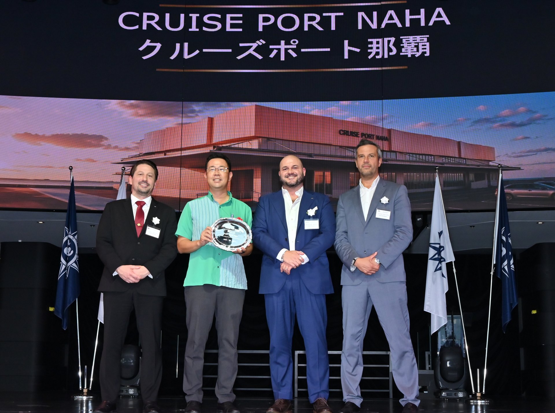 Groundbreaking ceremony of the new Cruise Port Naha terminal in Okinawa, with an image of the future building